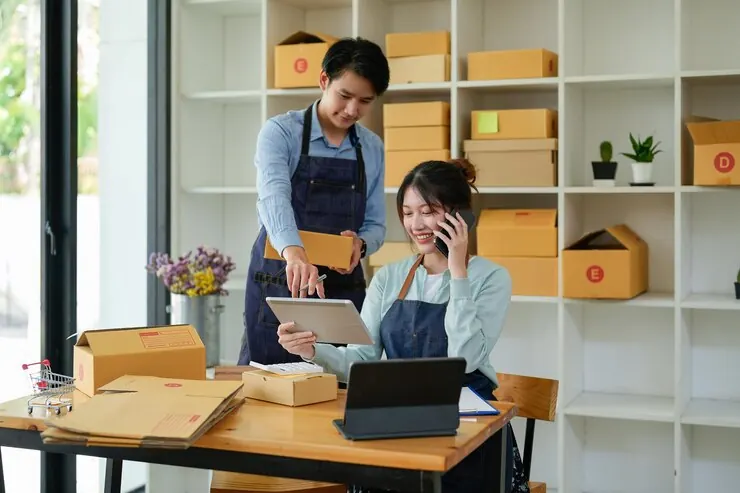 Small business owners preparing parcels for shipment